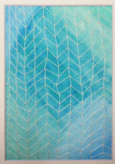 Watercolor overlaid with stitching