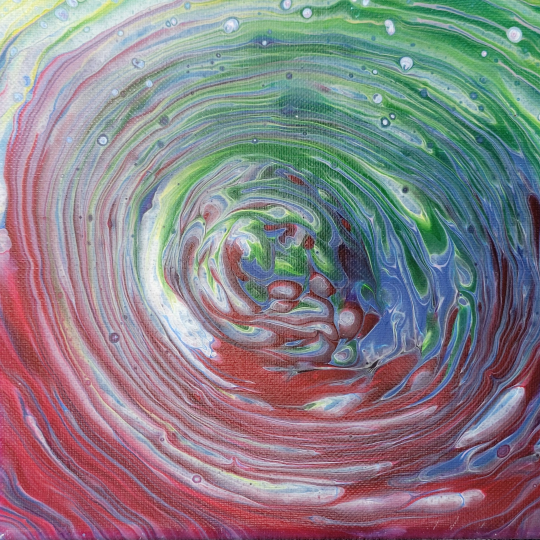 Pour-over acrylic painting in reds and greens. Pour-over acrylic painting in reds and greens.